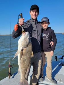 Father and Son black drum fishing TX